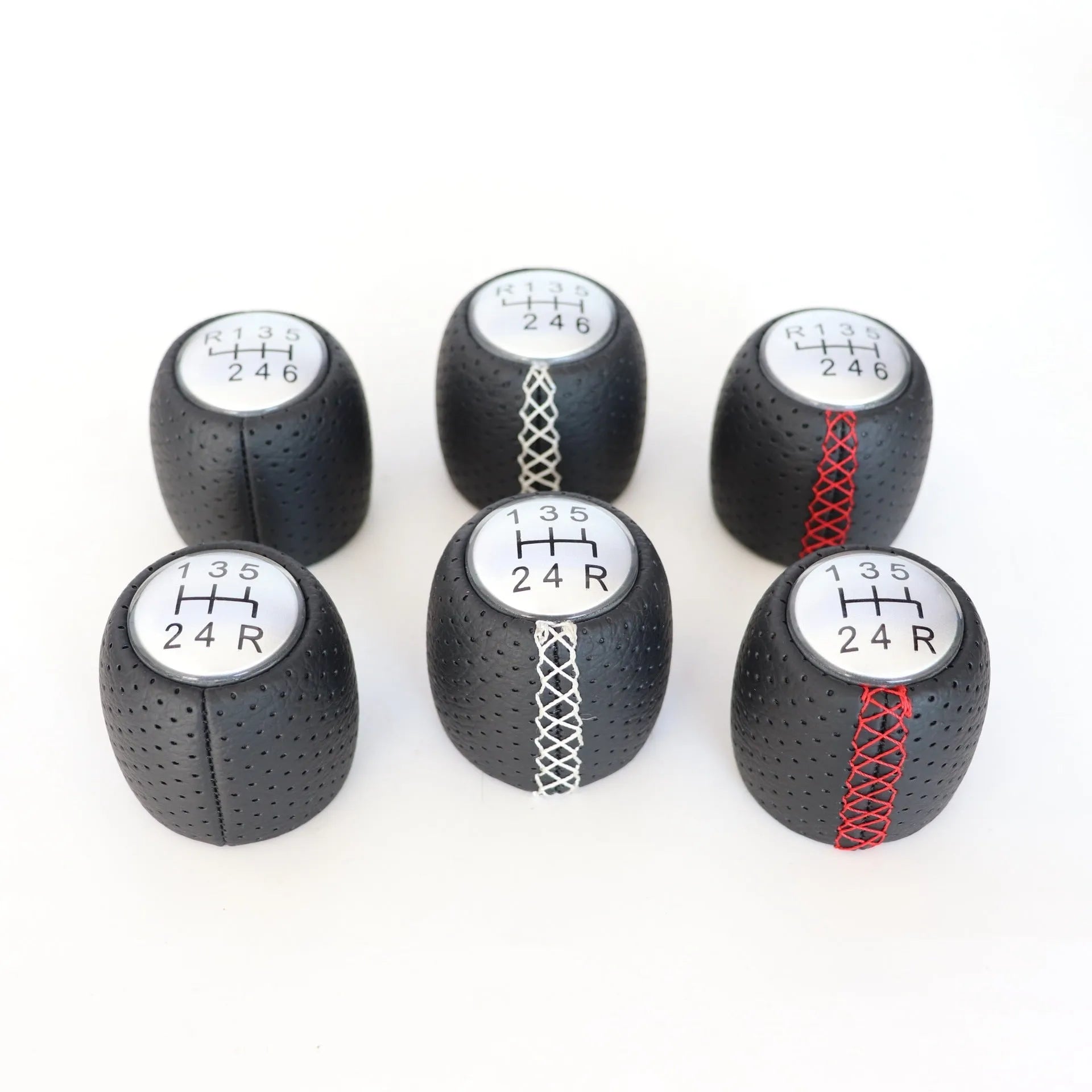 Black leather handball gear with perforations for Alpha car, shown with silver and matte cover options.