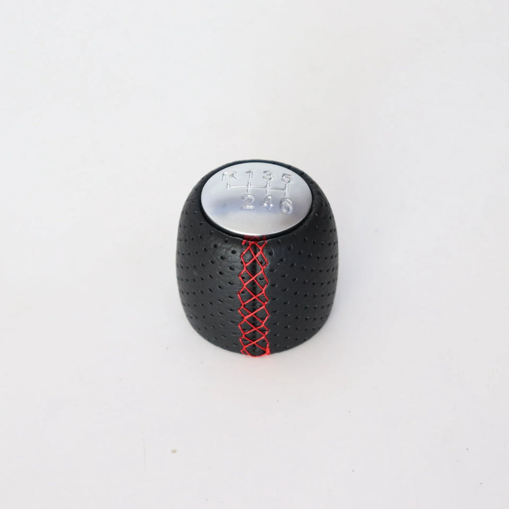 Black leather handball gear with perforations for Alpha car, shown with silver and matte cover options.