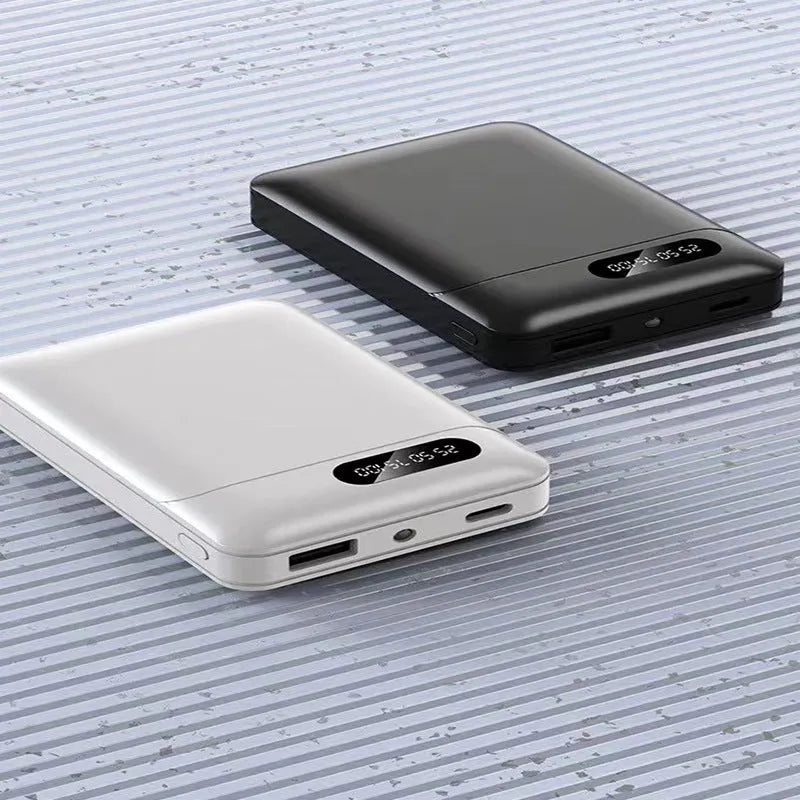 Black and white portable power bank with multi-U charging ports for smartphones and tablets