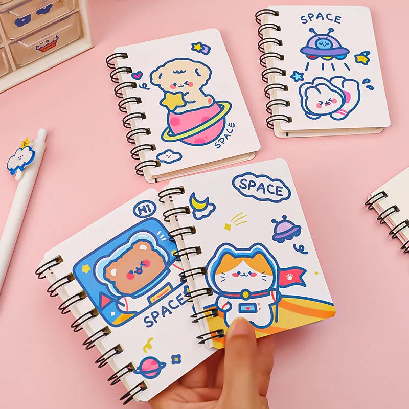 Astronaut themed flip-over pocket notebook showing 10.5cm by 8cm compact size