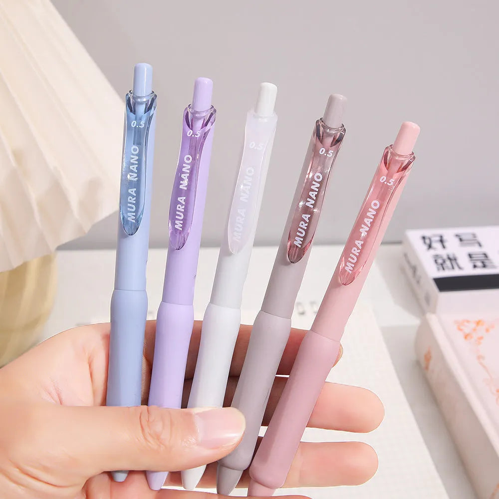 Macaron Colour press gel pen with 0.5mm tip in smoked white, brown, or pink ink options.