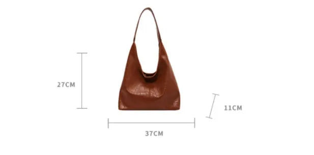 Casual soft PU leather large capacity shoulder bag in street trend style.