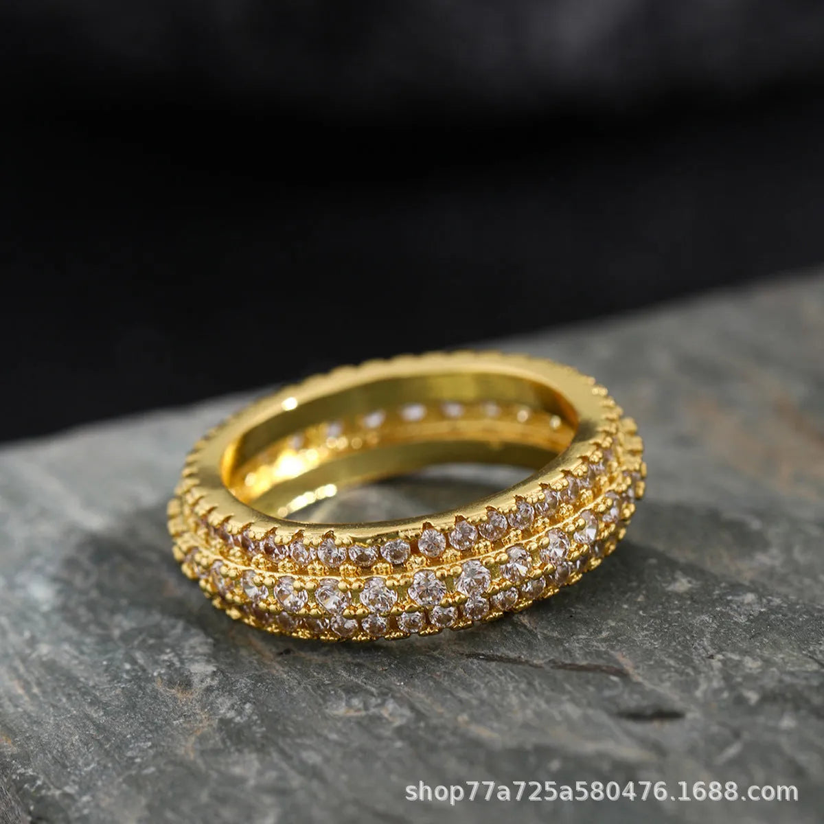 Geometric triangle design engagement ring with zircon stone inlay, shown in different metal plating finishes.