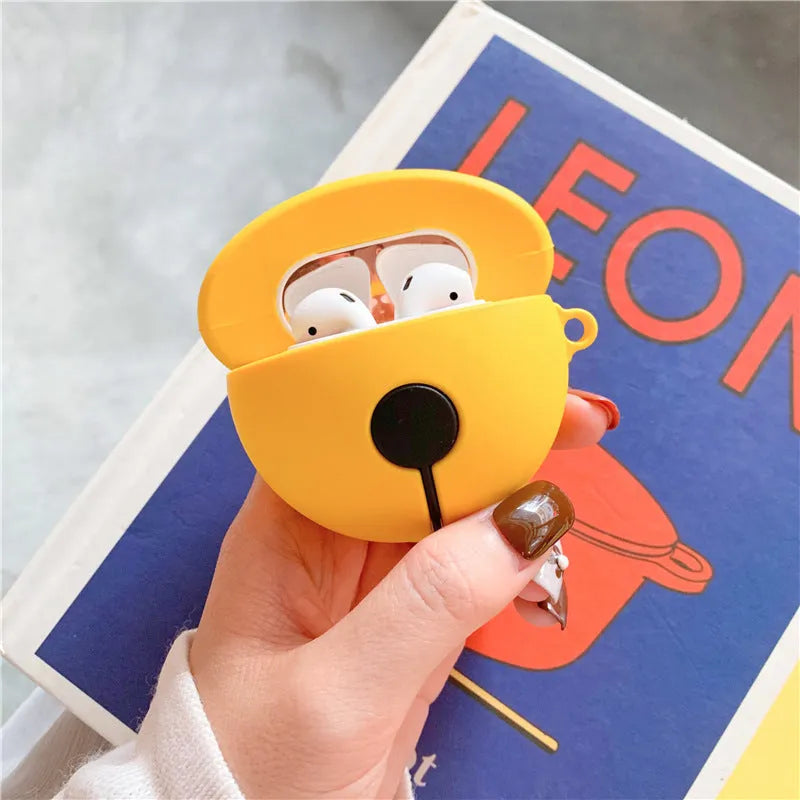 Bright yellow silicone case for AirPods 1 and 2 with a small silver bell charm attached.