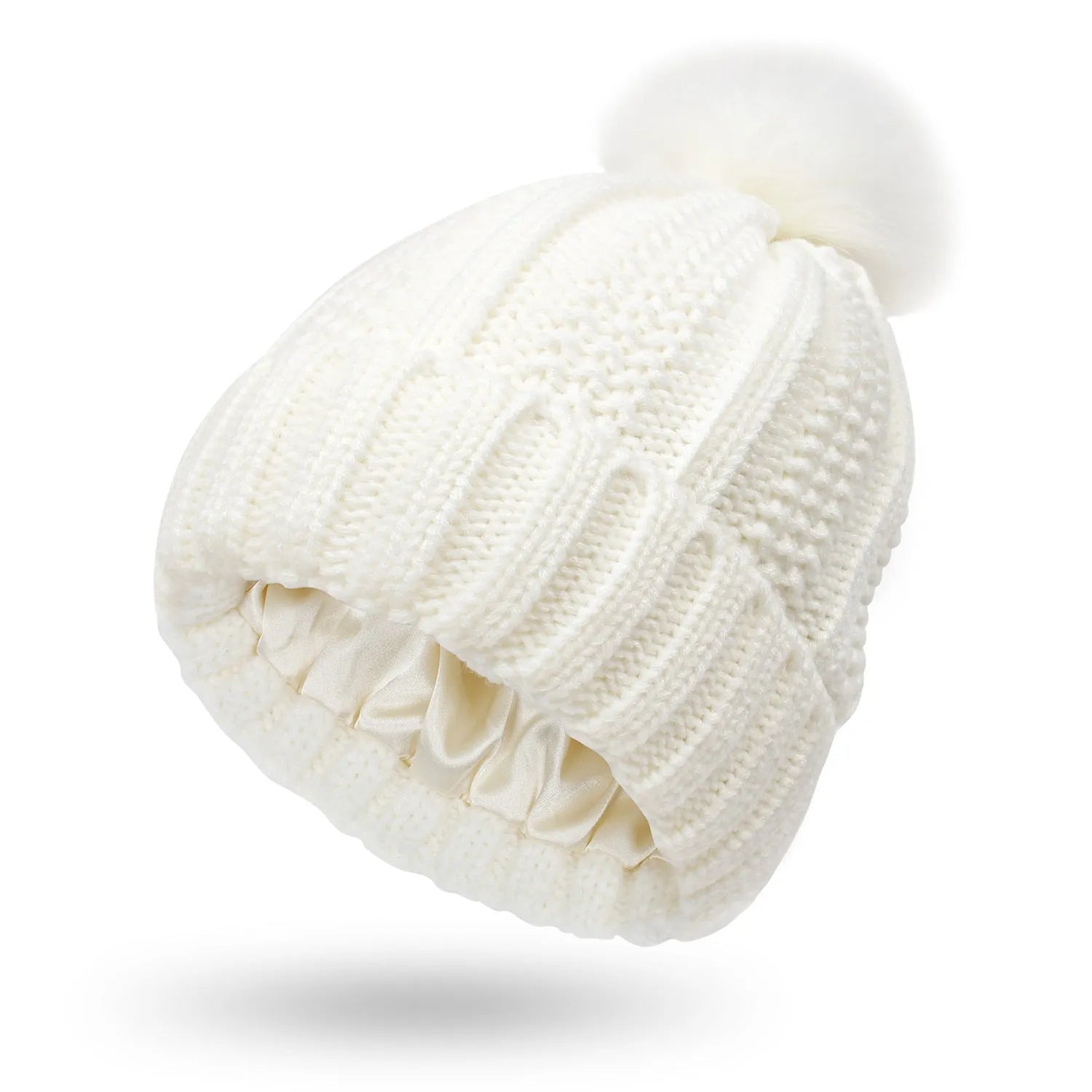 Woman wearing a light grey wool beanie with a faux fur pom pom and satin lining.