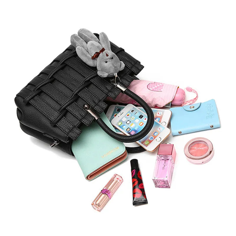 Women's PU shoulder handbag in black with multiple internal pockets and polyester lining
