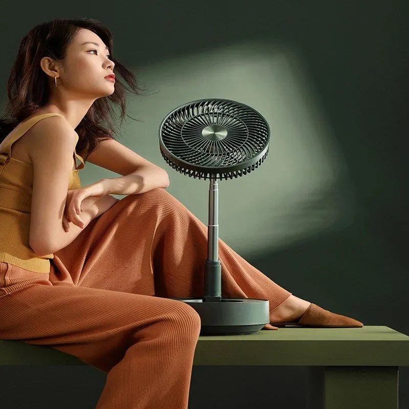 Green telescopic storage floor electric fan showing desktop and extended floor-standing configurations with remote control