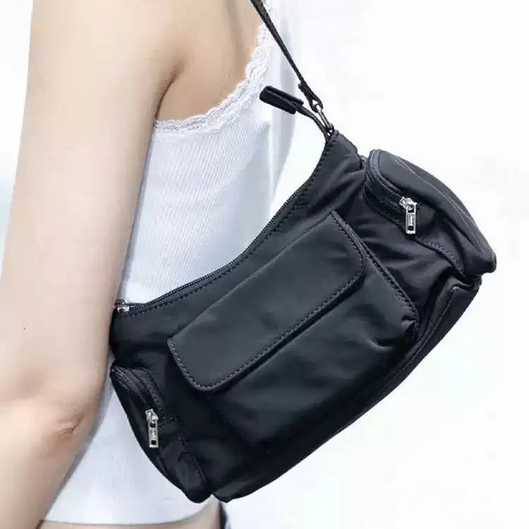 Black women's shoulder bag with side line detailing and double pockets