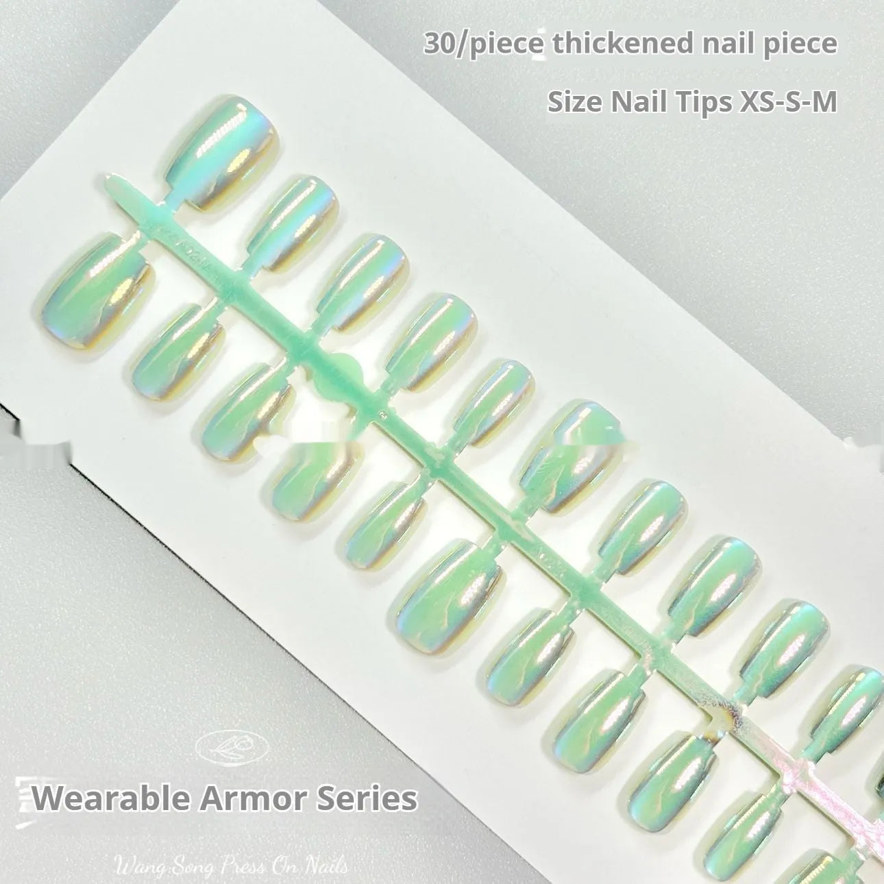 Set of electroplated Cat's Eye press-on false nails in short ladder length on a nail wheel.