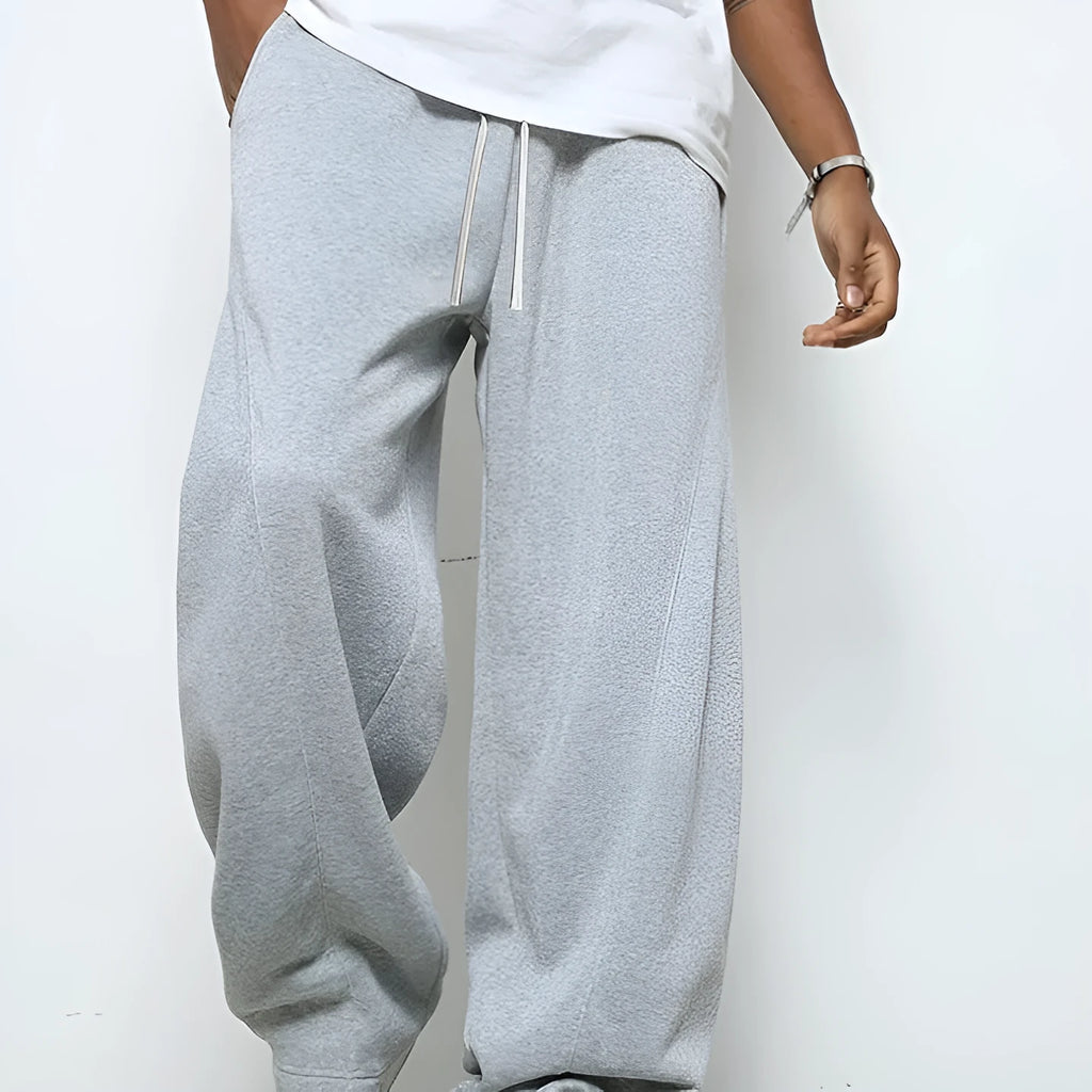Men's straight leg casual trousers in black colour with elastic waistband and drawstring closure