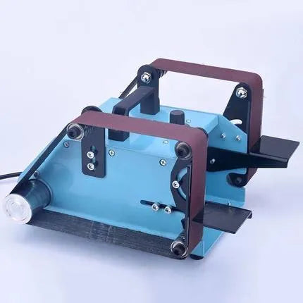 Blue desktop dual-axis belt sander and knife sharpening tool on a workbench.