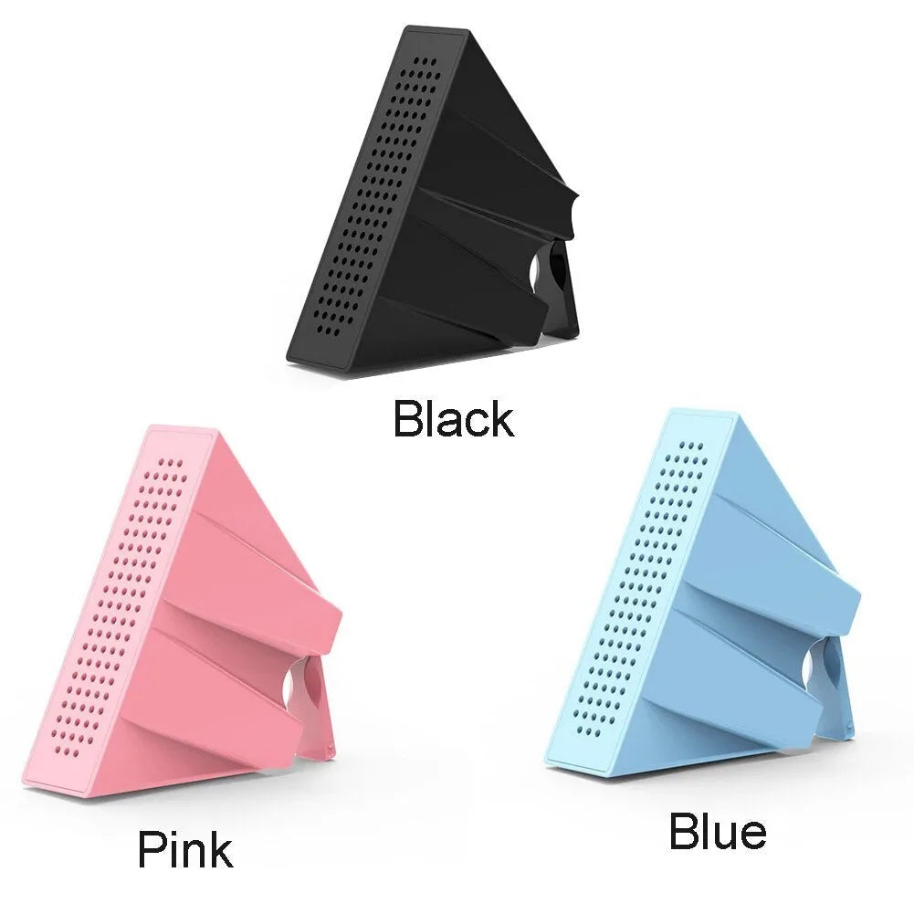Mini portable phone amplifier bracket for Apple iPhone on a desktop in pink colour.