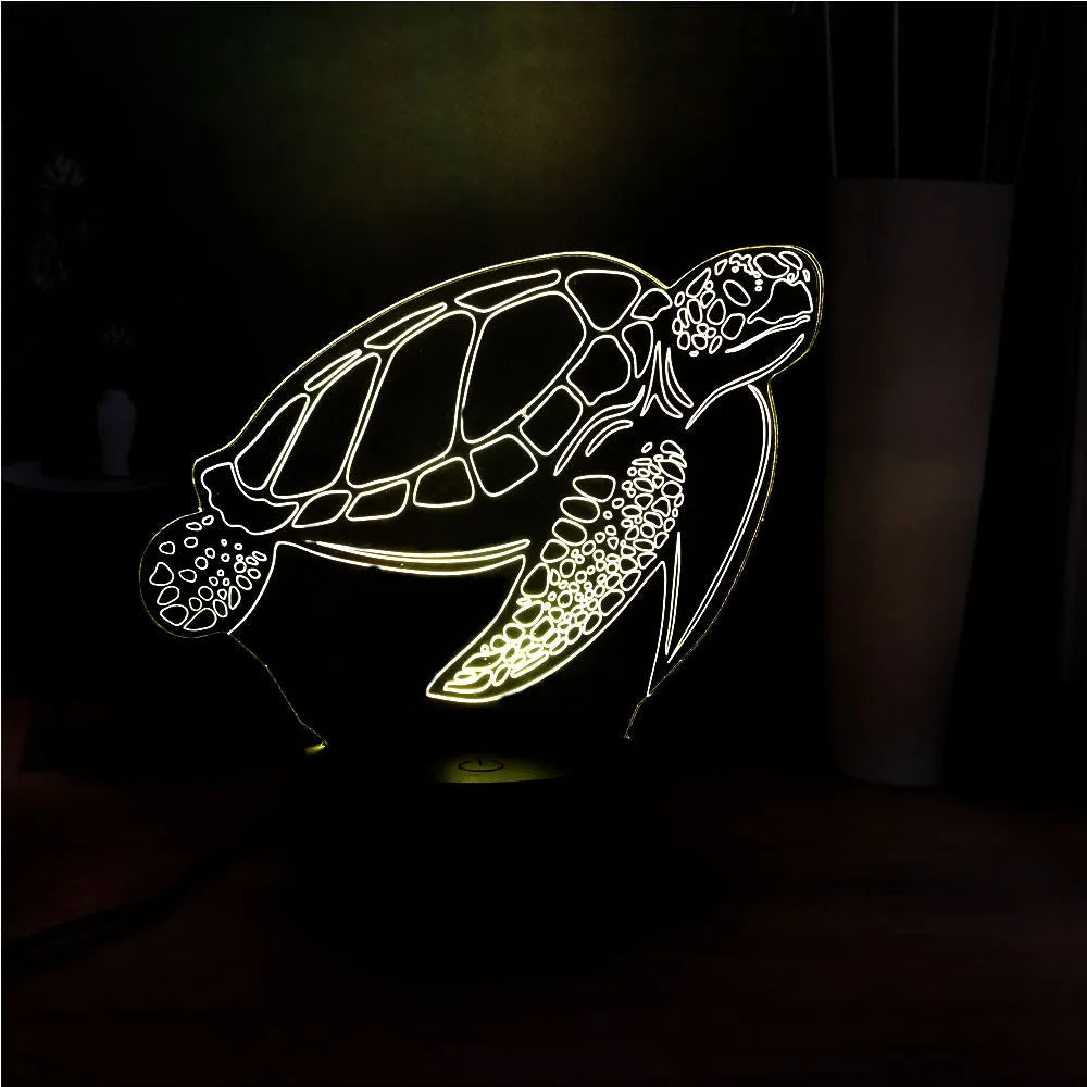 3D acrylic turtle-shaped LED night light showing colour-changing glow and remote control.