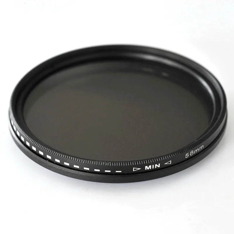 Adjustable camera ND filter kit with four density filters and a set of multi-diameter metal adapter rings.