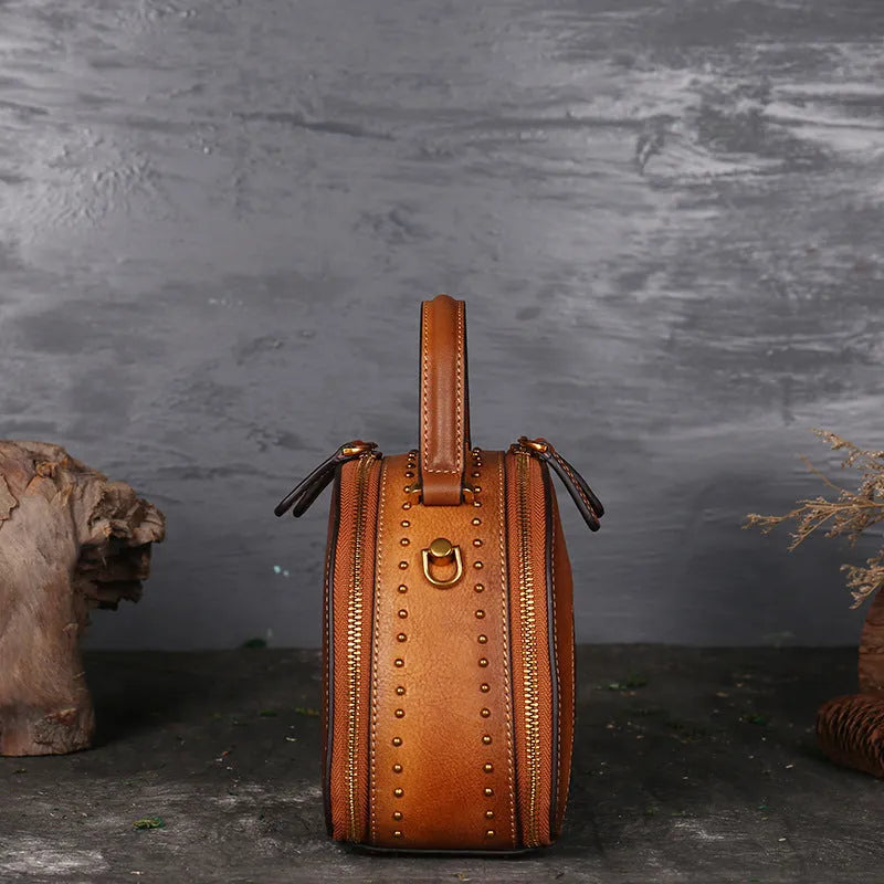 Vintage cowhide leather handbag with suede accents showing interior compartments including ID bag and mobile phone pocket