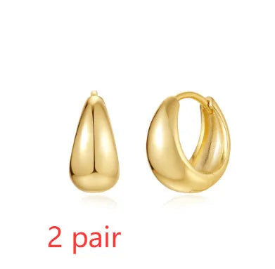 Golden electroplated brass earclip earrings with geometric round design