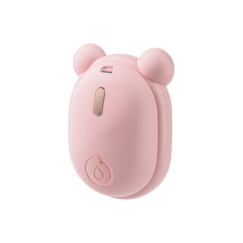 Pink rechargeable pet grooming brush with spray button and removable silicone comb head