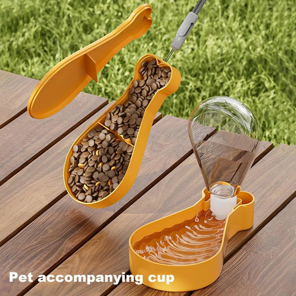 Orange and white portable pet water bottle with separate food container showing measurement scale