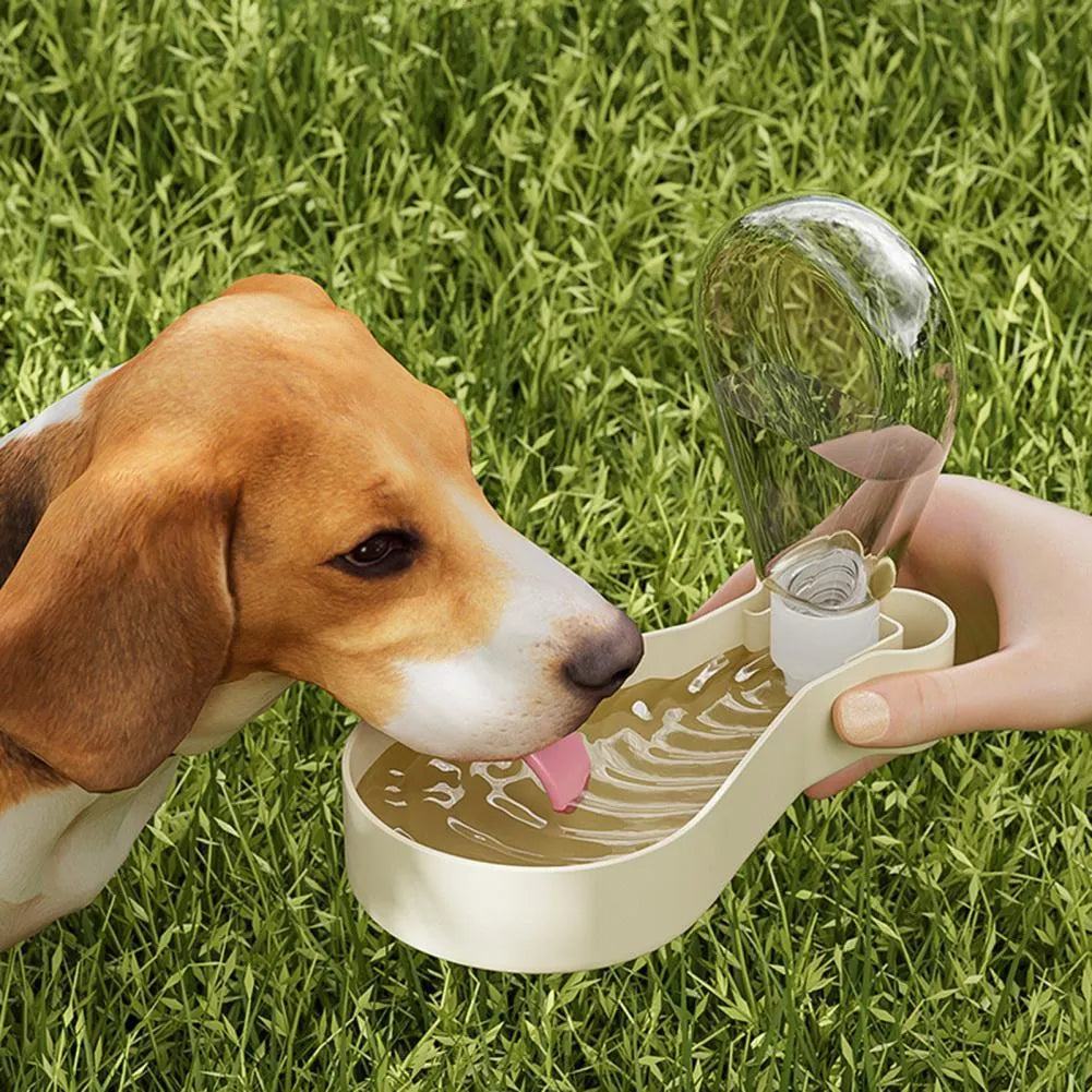Orange and white portable pet water bottle with separate food container showing measurement scale
