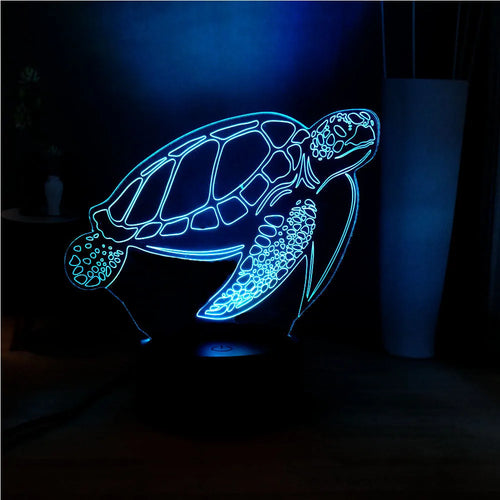 3D acrylic turtle-shaped LED night light showing colour-changing glow and remote control.