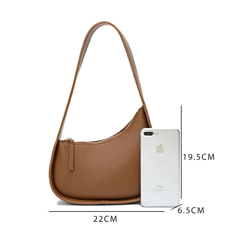 Genuine leather half moon ladies shoulder bag with wide strap and zipper closure in small size