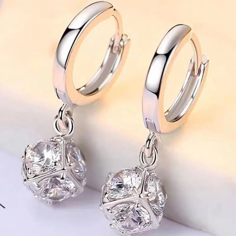 Geometric rose detail zircon earrings for women in copper, available in multiple colours.