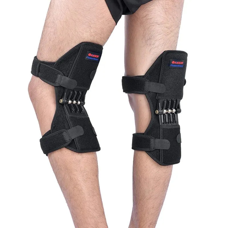 Adjustable black spring knee brace with straps and venting holes for sports support.