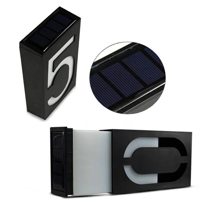 Solar powered white LED house number light mounted on a wall with IP65 waterproof rating