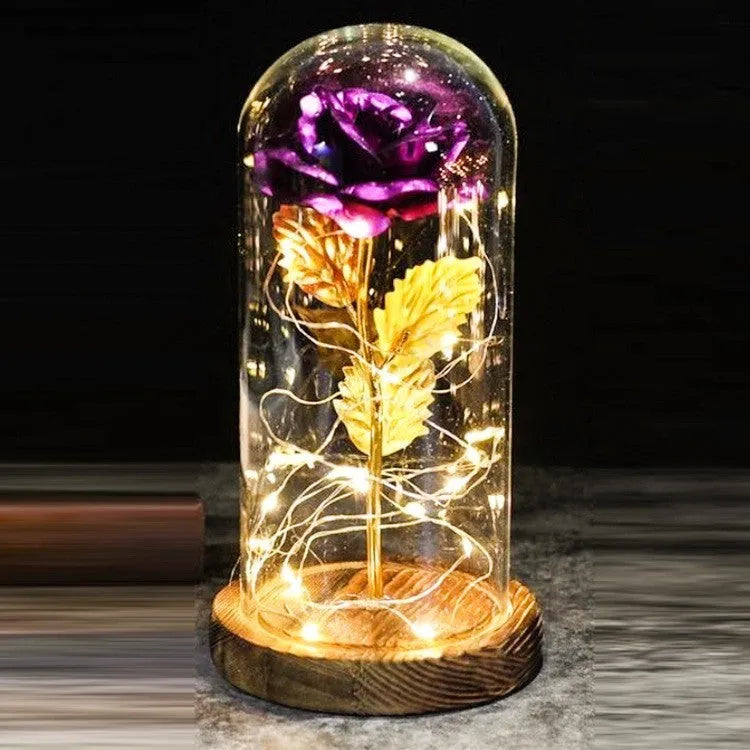 Silk rose bouquet with LED lights and glass shade in scarlet colour on wooden base