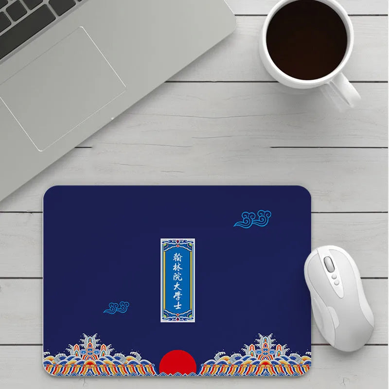Custom cartoon thickening mouse pad on a desk, showing a colourful design with black stitched edge.