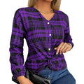 Woman wearing a loose-fitting purple, grey, and red plaid casual shirt with regular sleeves.