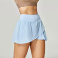 Women's solid colour quick-drying sports shorts in nylon and spandex for running and fitness.