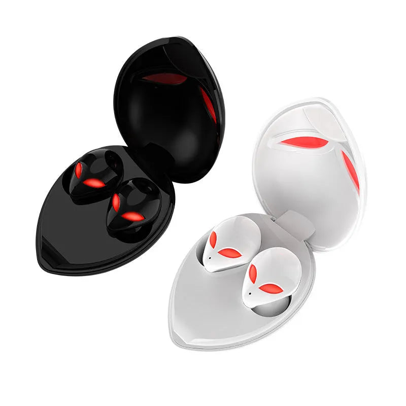 Alien-themed Creative Outer T8 Starman black wireless earbuds with red LED lights next to charging case.