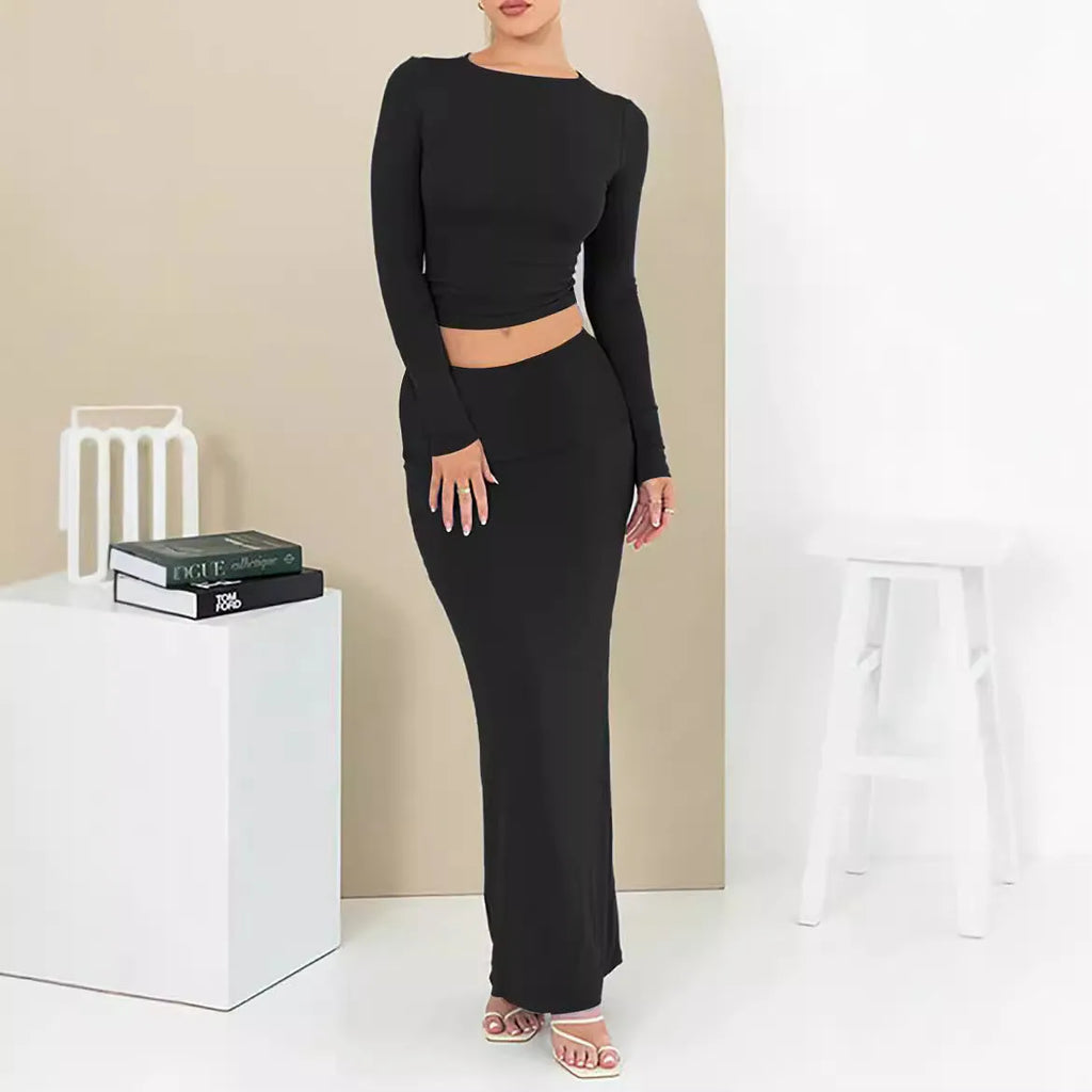 Women's black slim fit polyester two-piece suit with three-quarter sleeve top and long skirt.