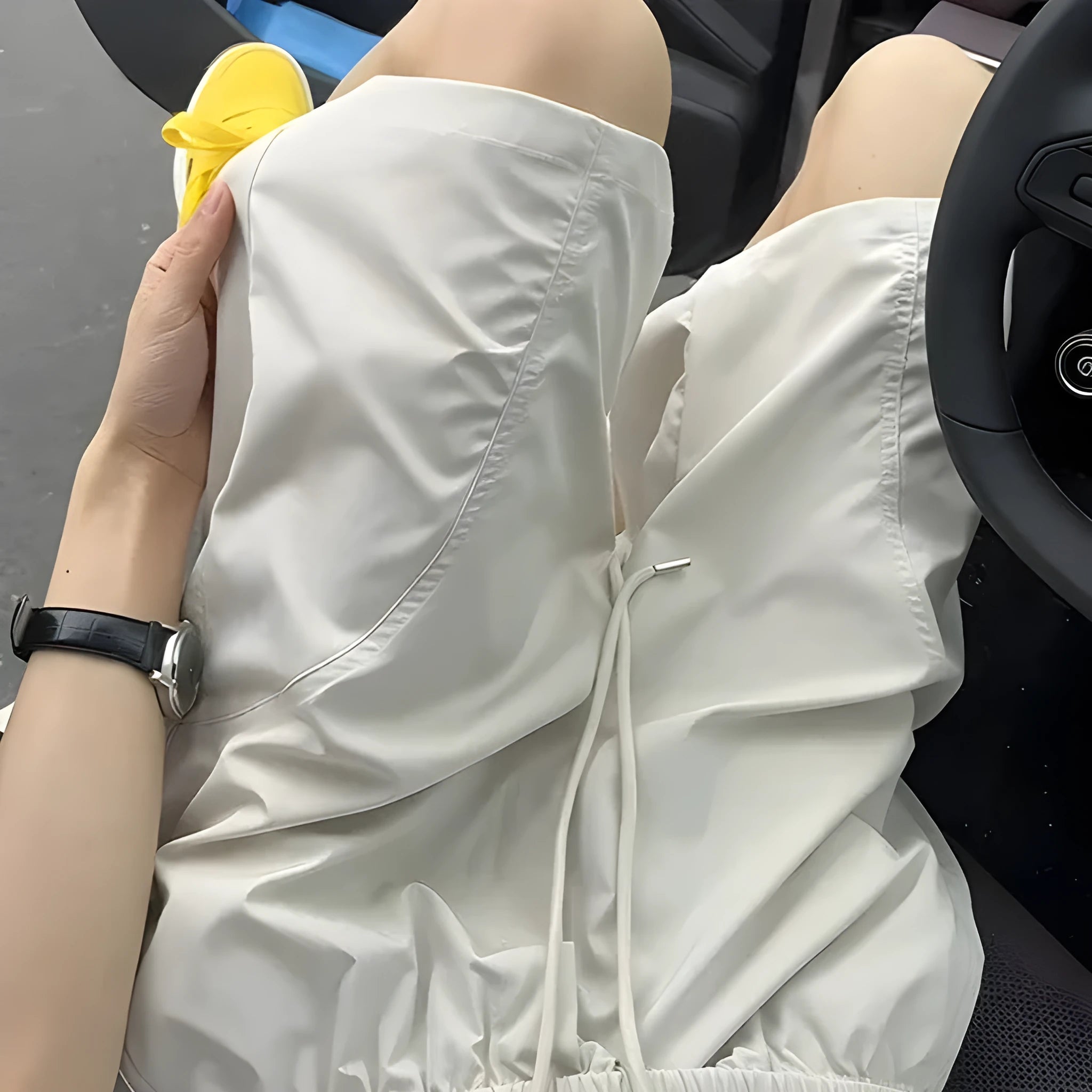 Men's beige quick-drying polyester sports shorts with elastic waistband, shown in a straight cut style.