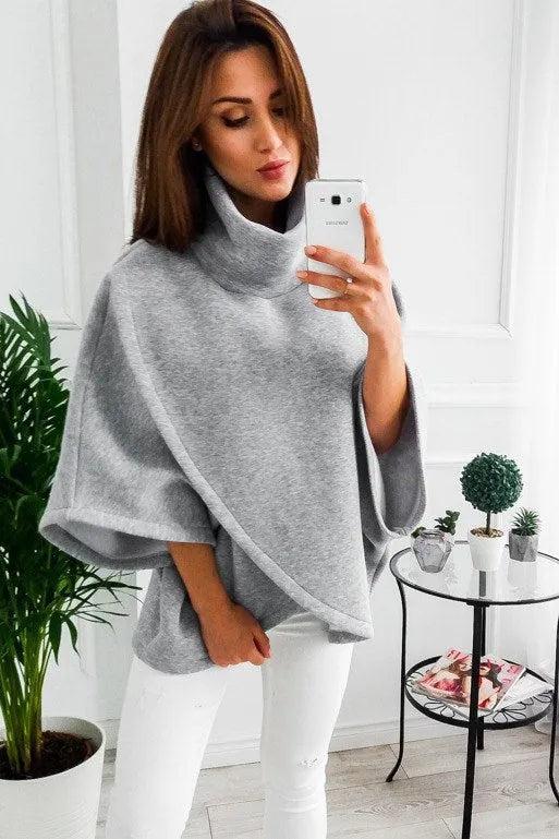 Women's extended length cardigan with bat sleeves and three-button placket in multiple colour options