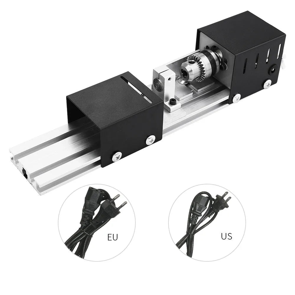 Mini silver metal woodworking lathe with carving knives on benchtop for small-scale turning projects
