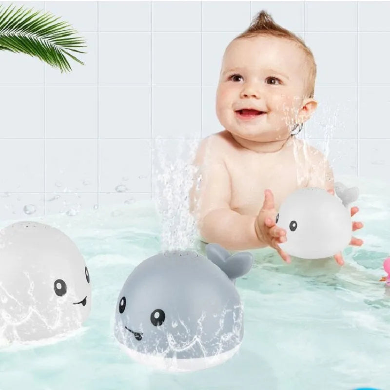 Automatic water spray whale bath toy with colourful LED lights floating in baby bath