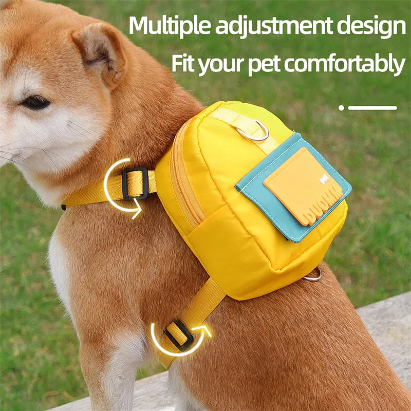Blue adjustable dog backpack harness with storage compartments and a tow rope, shown on a medium-sized dog.