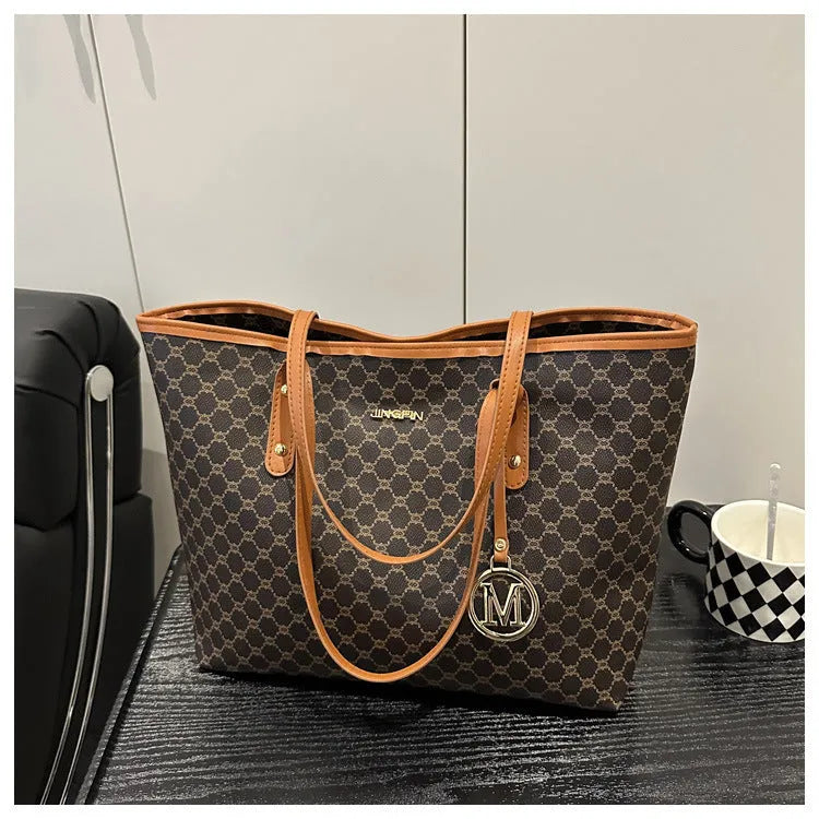 Western style PU leather shoulder bag showing sewing thread detailing, 42cm wide by 28cm tall, available in black, grey, white, and brown colours