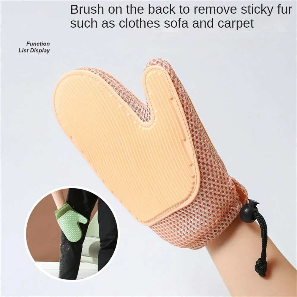 Dark blue pet hair removal glove with mesh surface for grooming dogs and cats and cleaning furniture.