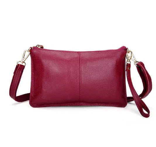 Lady cowhide slant bag in apricot showing top layer leather texture and dual straps