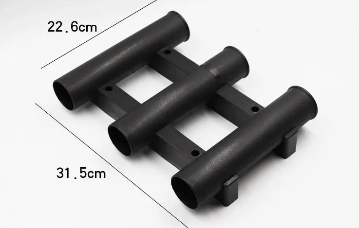 Black sea fishing rod turret with 3 holes and 6 extension screws on a sandy beach