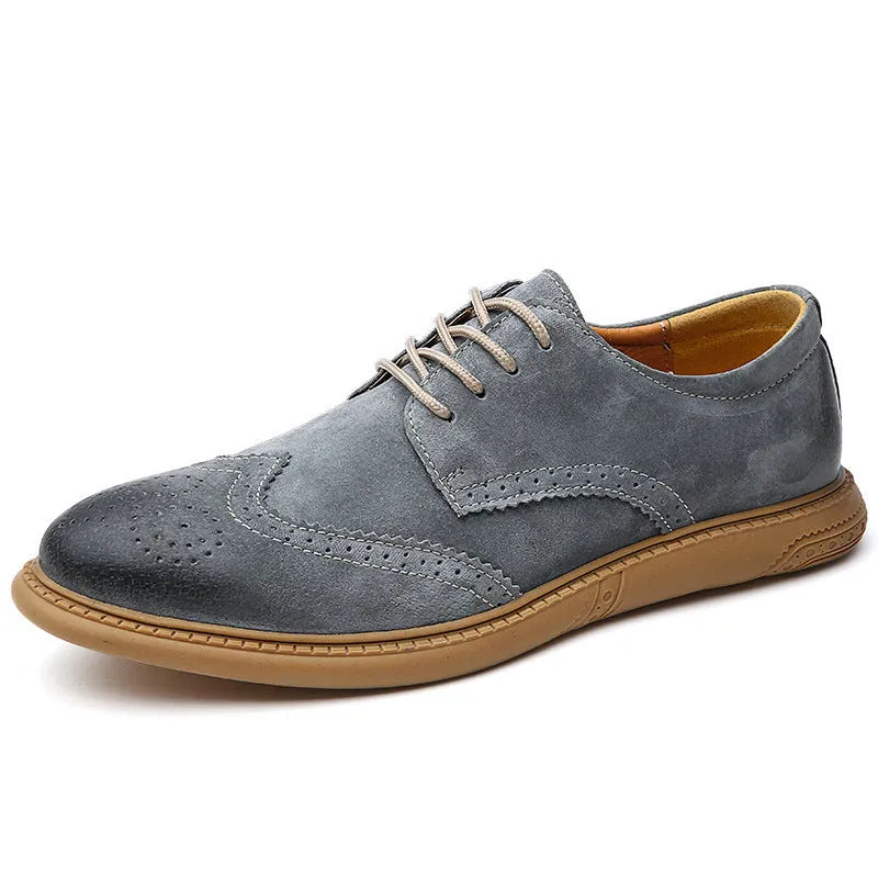 Men's grey low-top leather business shoes with lace-up design and non-slip rubber sole.