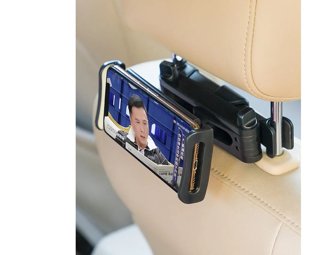 Black universal car phone holder mounted on vehicle rear seat base with tablet secured in snap-in mechanism