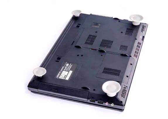 Four grey durable plastic laptop cooling pads shown in two different sizes on a table