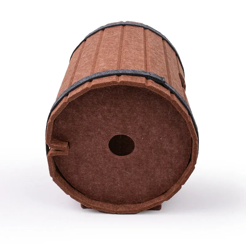 DIY wine barrel shaped cat bed made from three brown felt panels with binding straps