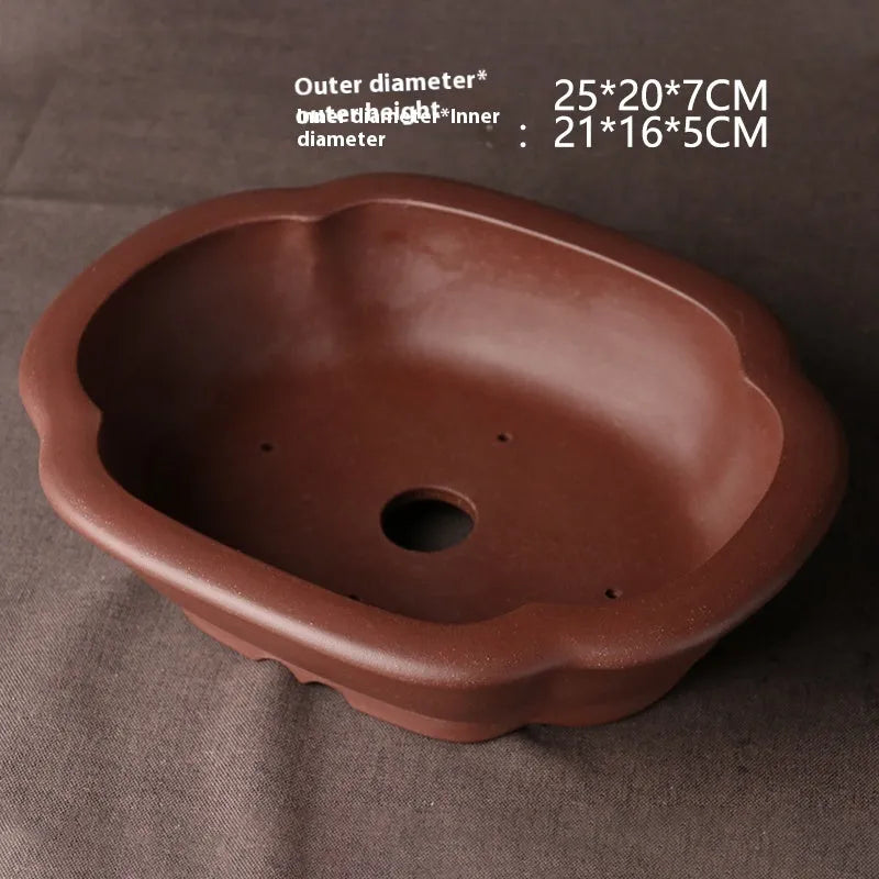Handmade plain purple clay bonsai pot measuring 25 by 20 by 7 centimetres.