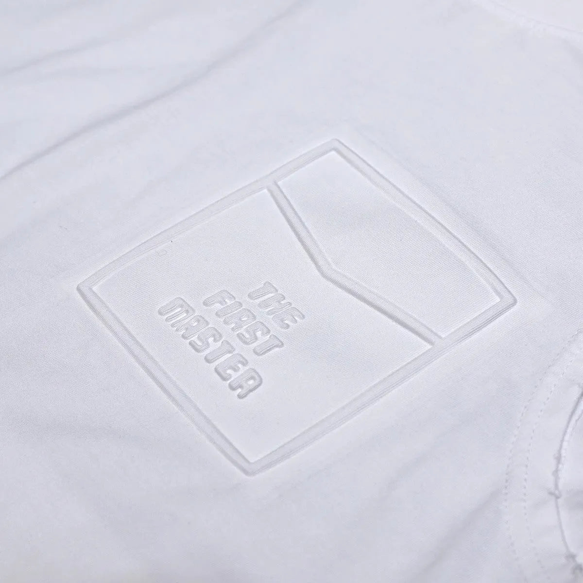 Men's solid colour cotton sleeveless t-shirt in loose fit, shown in white and black.