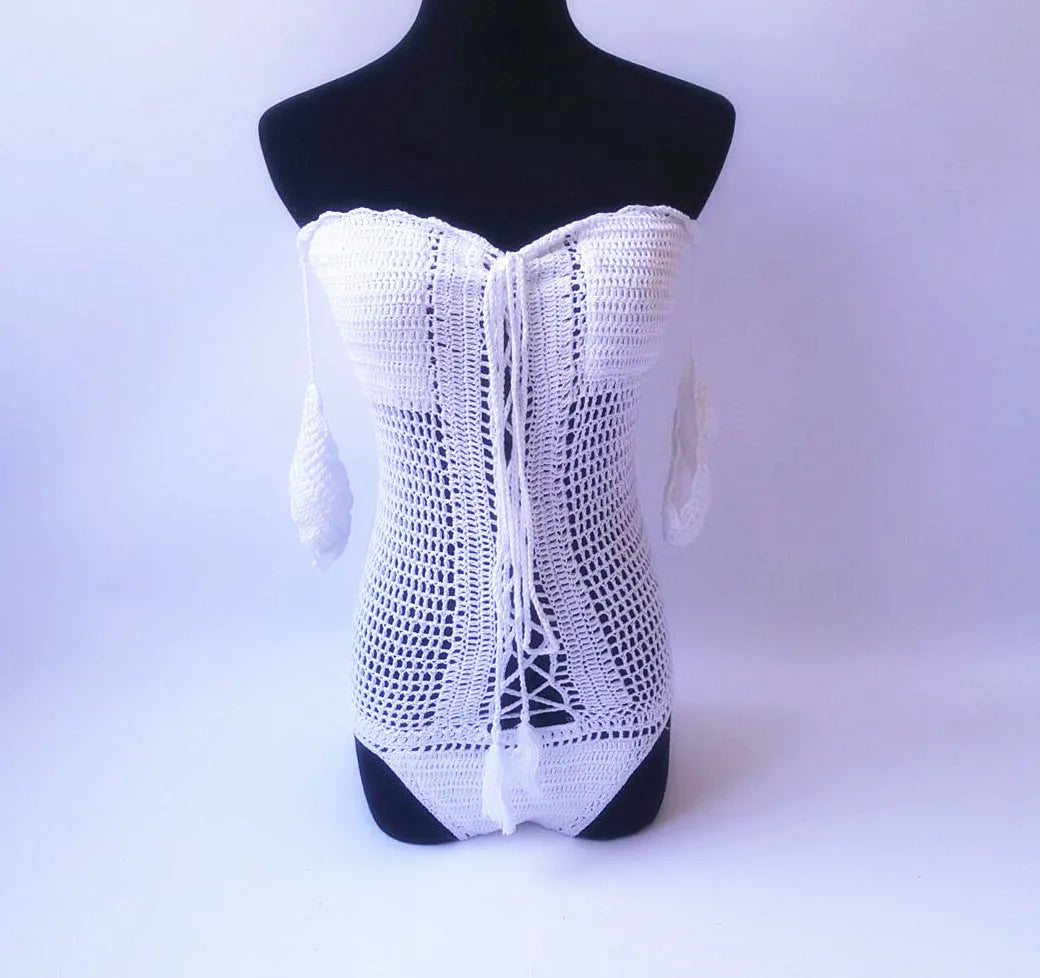 Women's white off-the-shoulder one-piece swimsuit on a mannequin, showing the neckline design.